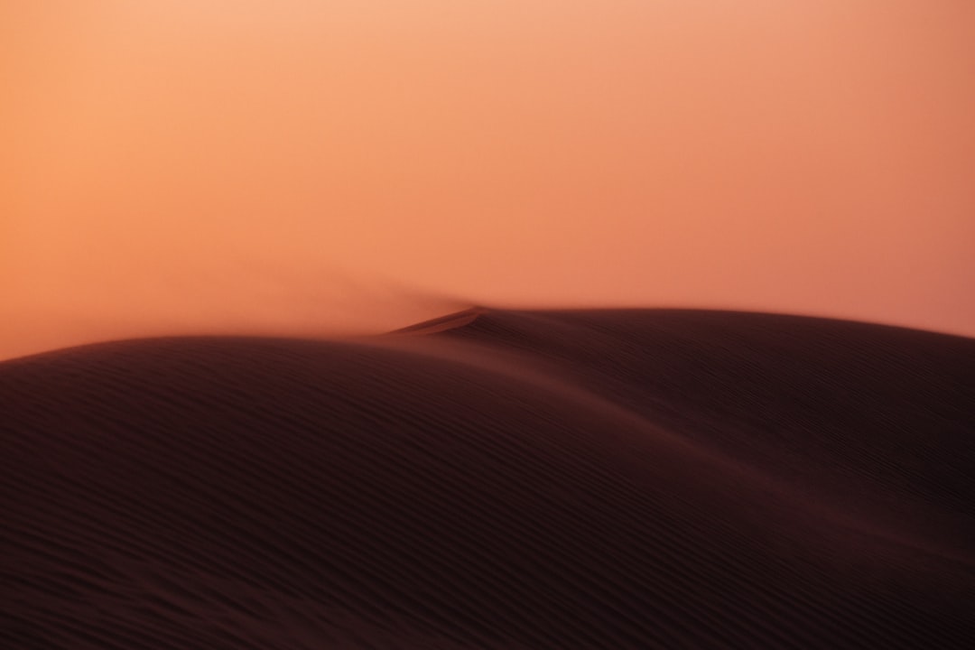 Desert dunes at sunset in Dubai, symbolizing emerging growth corridors