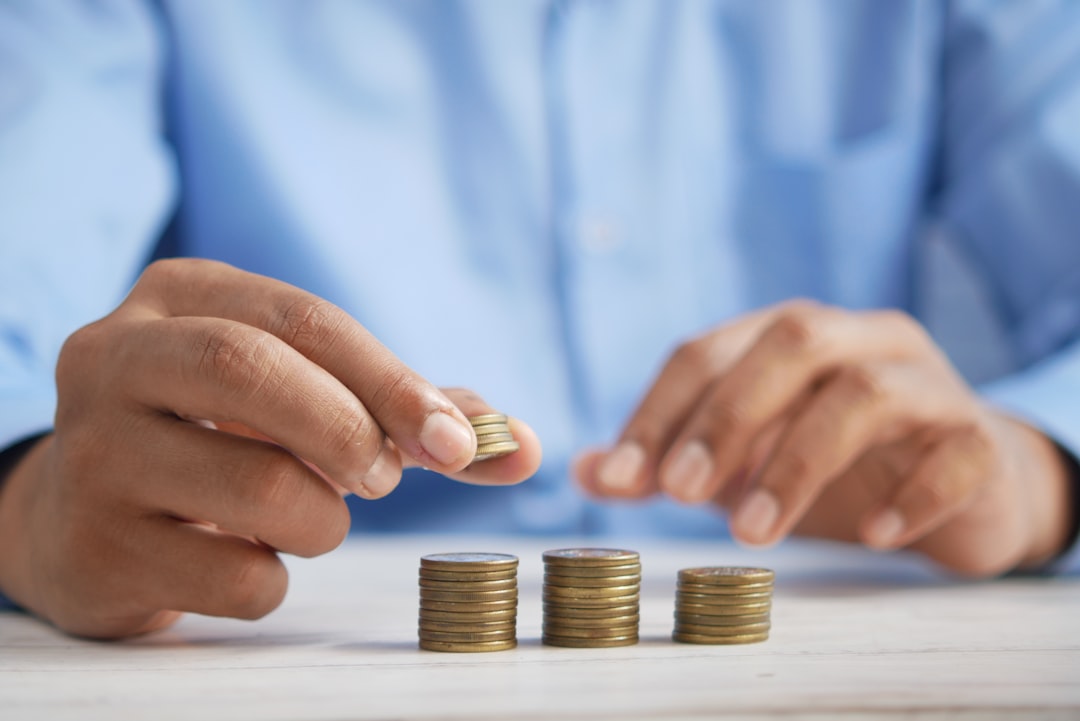 Stacking coins representing tax-free investment growth in Dubai real estate